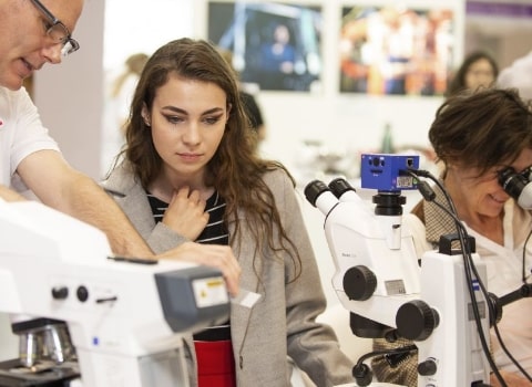 Scientist demonstrating to a prospective student.